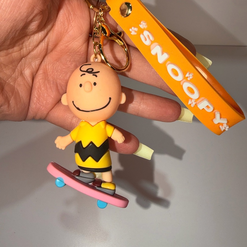 Peanuts Charlie Brown Yellow Skateboard Keychain by